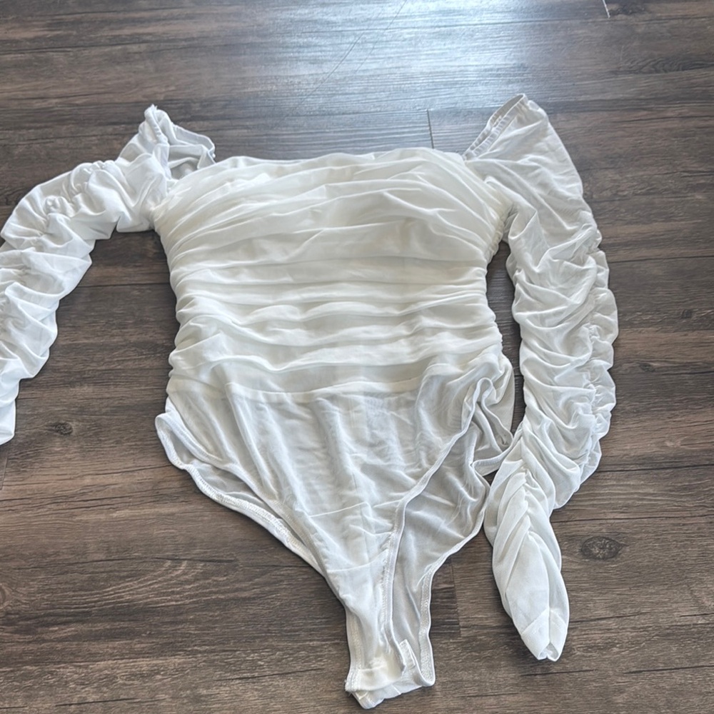 White Ruffled bodysuit from hello Molly